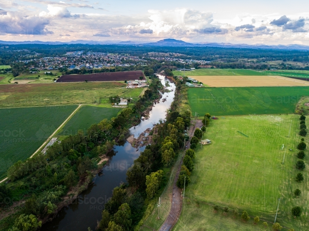 Image of Aerial view of Hunter River running through farmland in town ...