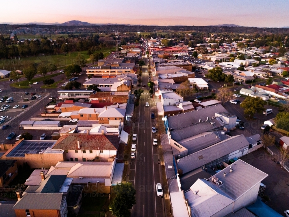 Aerial view of John Street main shop district in small town of Singleton at dusk - Australian Stock Image