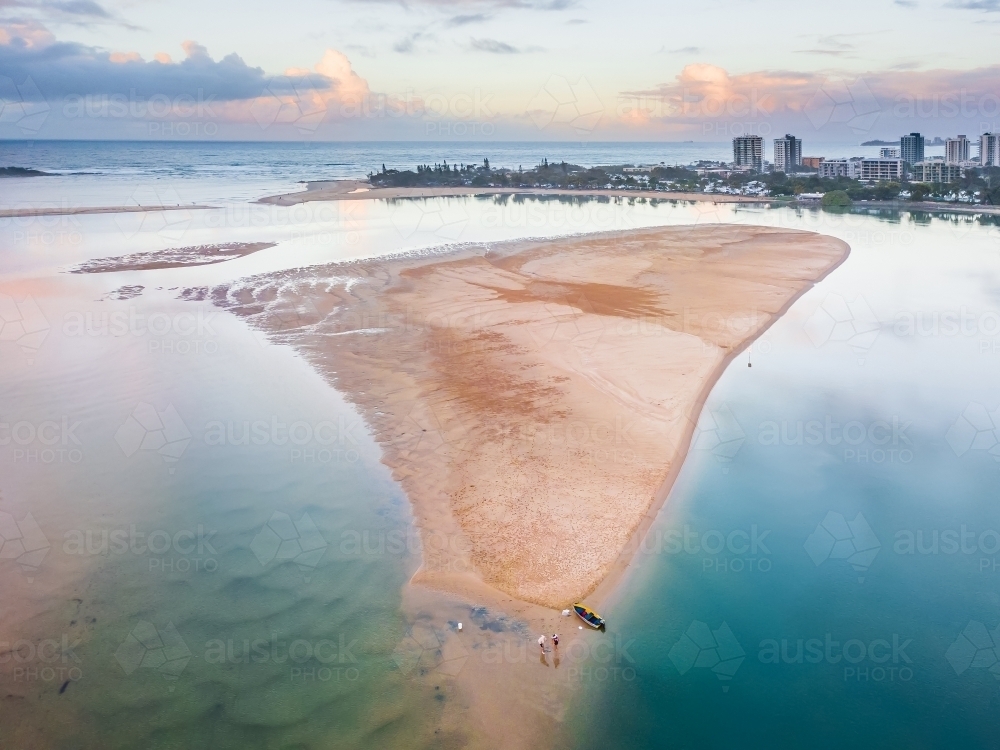 Aerial view of kayakers on a sandbar in a river mouth near the ocean. - Australian Stock Image