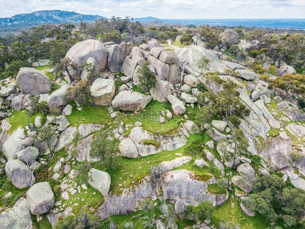 Aerial view of large granite boulders on a hill top - Australian Stock Image