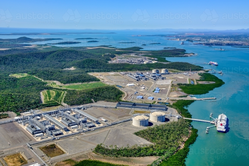 Aerial view of liquified natural gas plant and LNG ship on Curtis Island, Queensland - Australian Stock Image