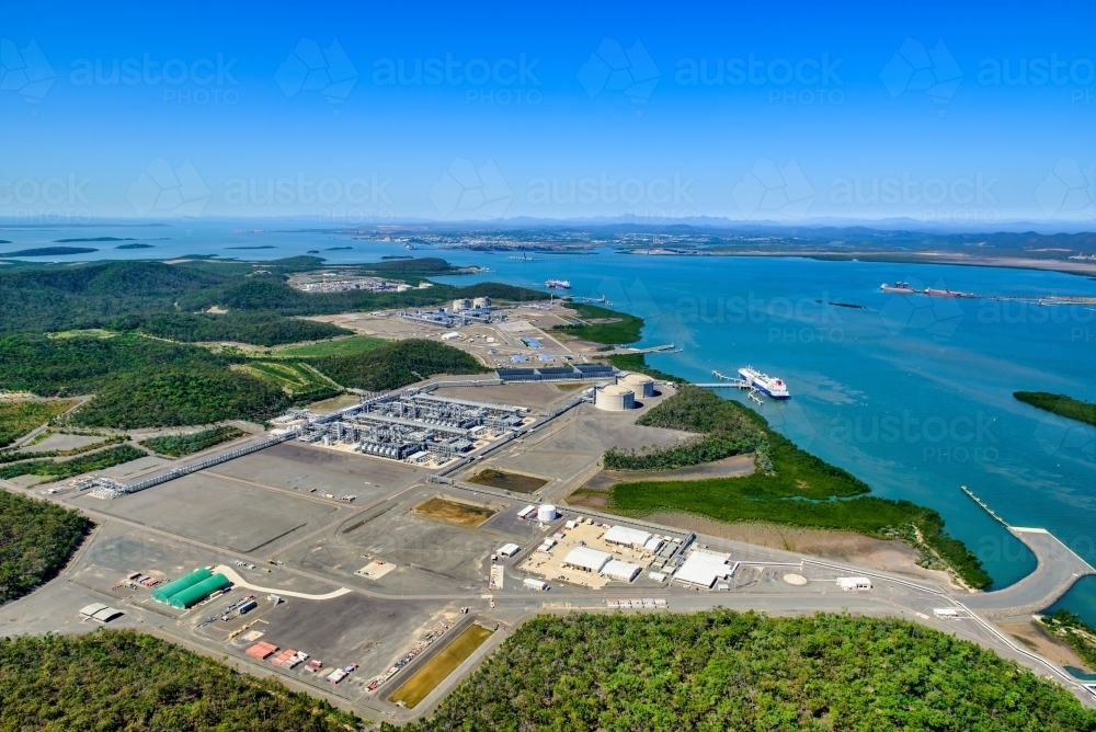 Aerial view of liquified natural gas plant and LNG ship on Curtis Island, Queensland - Australian Stock Image