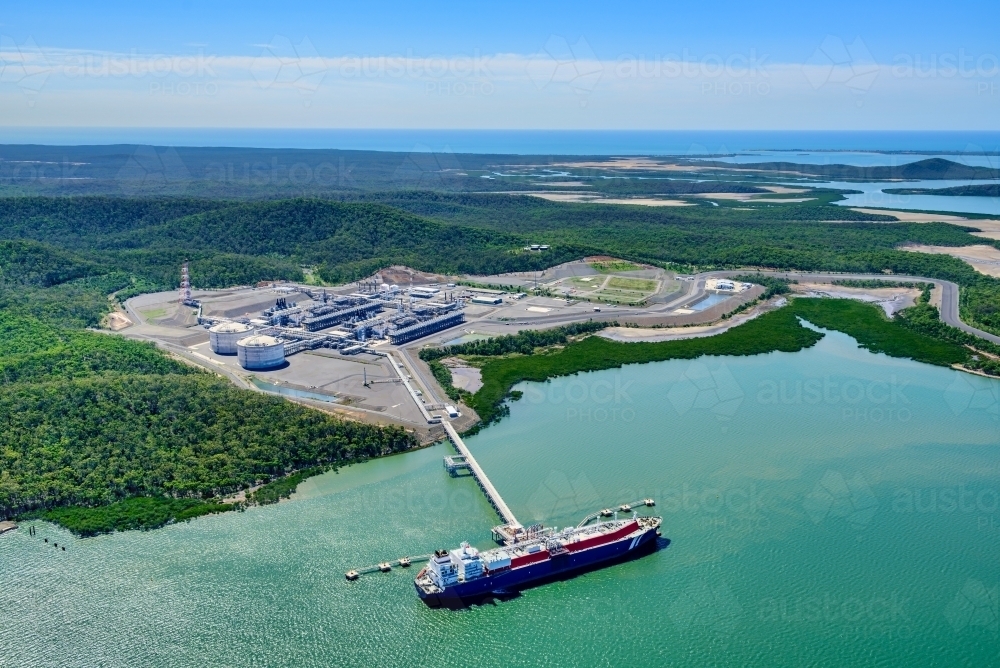 Aerial view of liquified natural gas plant and LNG ship on Curtis Island, Queensland - Australian Stock Image