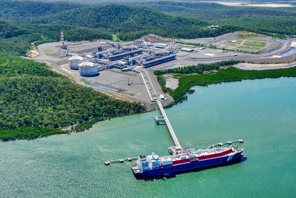 Aerial view of liquified natural gas plant and LNG ship on Curtis Island, Queensland - Australian Stock Image