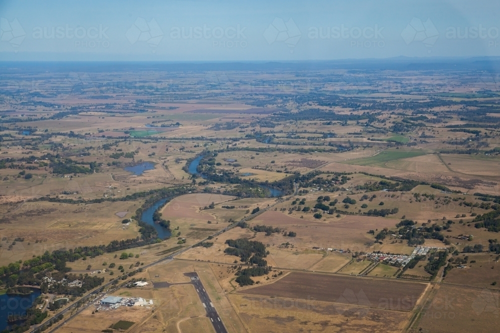 Aerial view of Lismore airport landing strip and surrounding farm land - Australian Stock Image