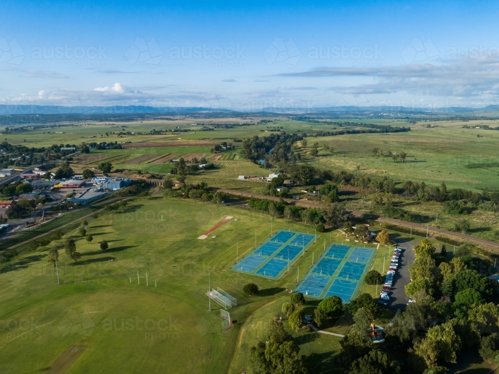 Aerial view of long jump track and pit at Cook Park  beside netball courts and sports field - Australian Stock Image