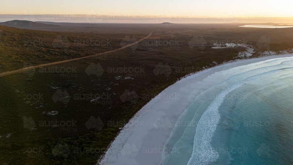 Aerial view of long stretched white sand beach - Australian Stock Image