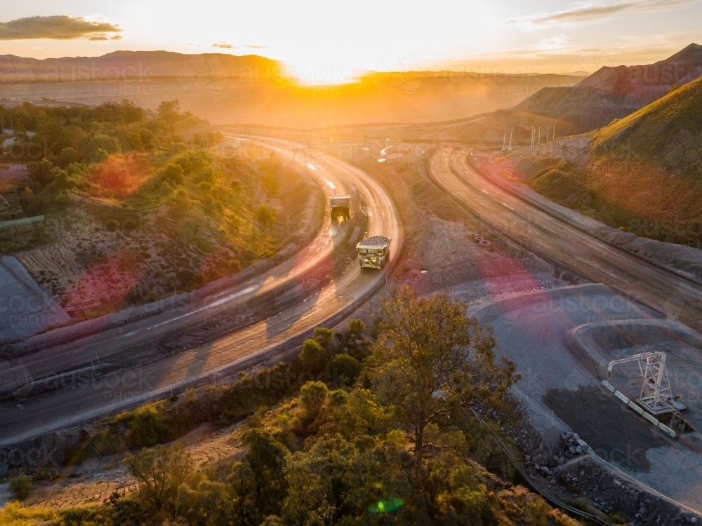 Aerial view of mining dump truck machinery collecting coal in open cut mine - Australian Stock Image