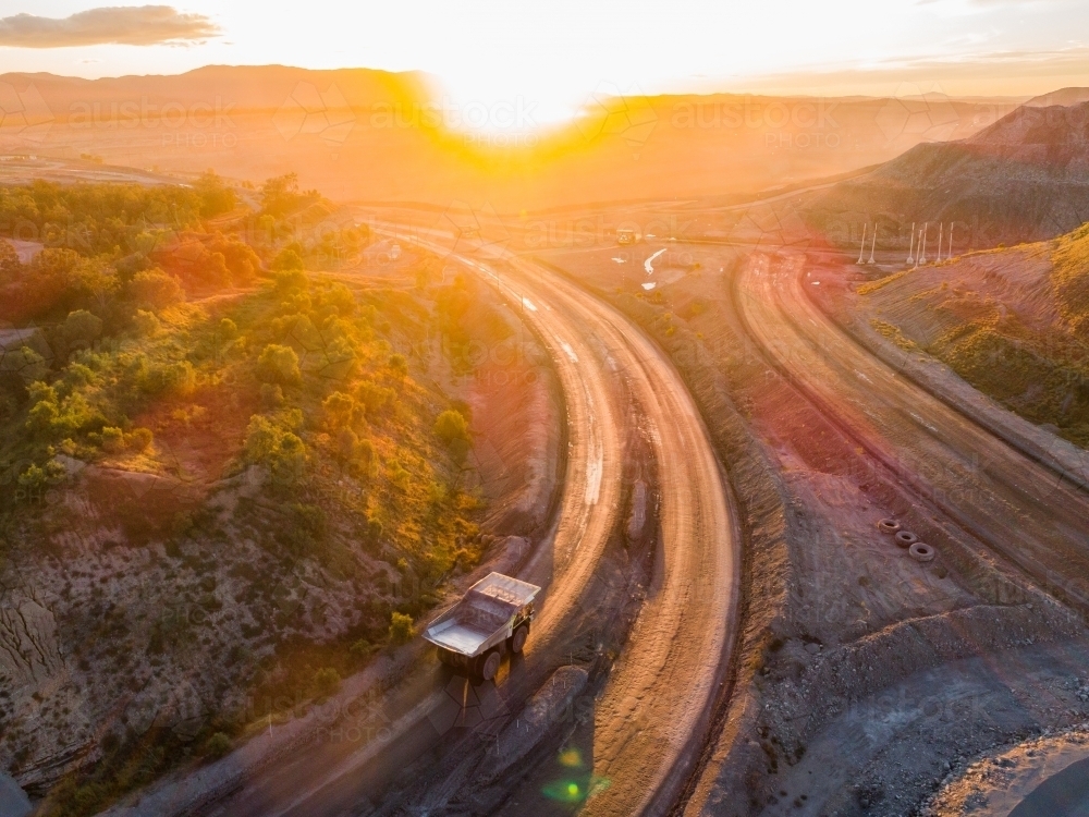 Aerial view of mining dump truck machinery collecting coal in open cut mine - Australian Stock Image