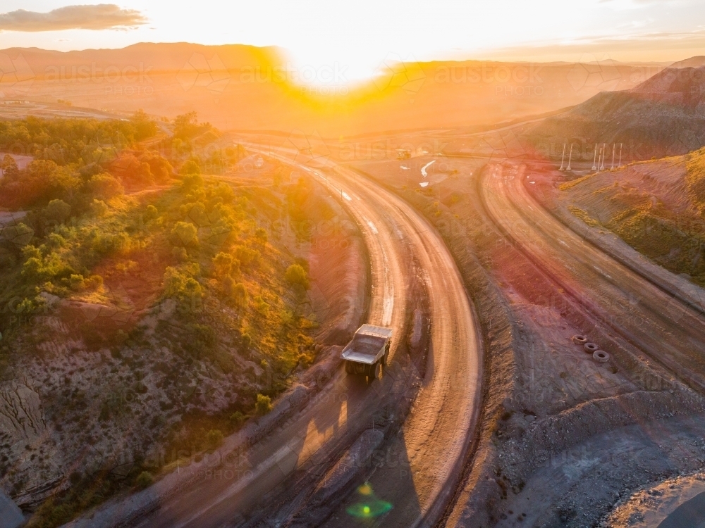 Aerial view of mining dump truck machinery collecting coal in open cut mine - Australian Stock Image