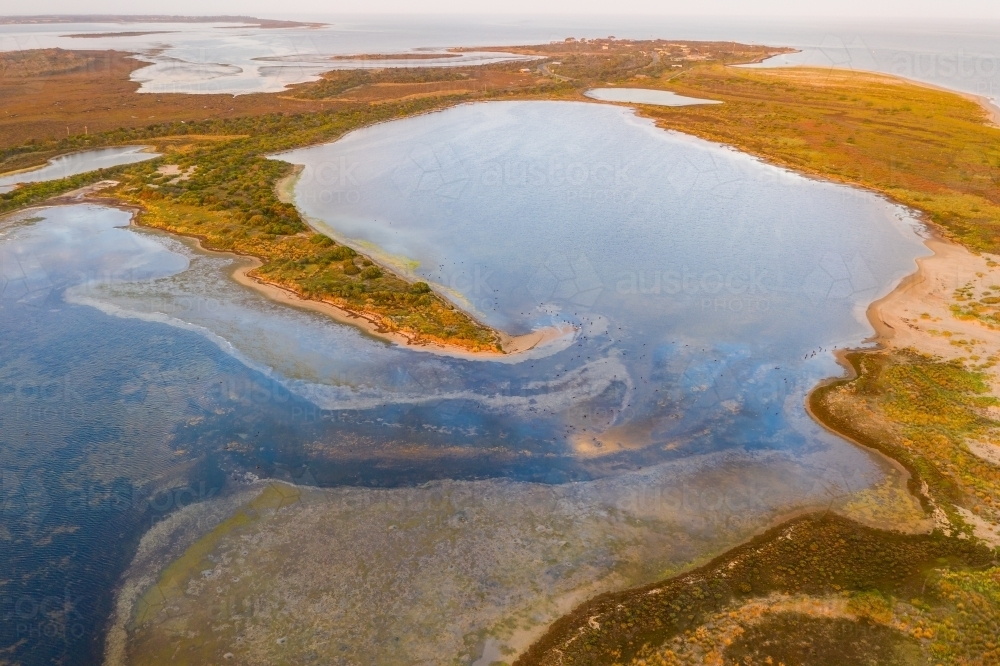 Aerial view of narrow peninsula in a coastal lagoon - Australian Stock Image