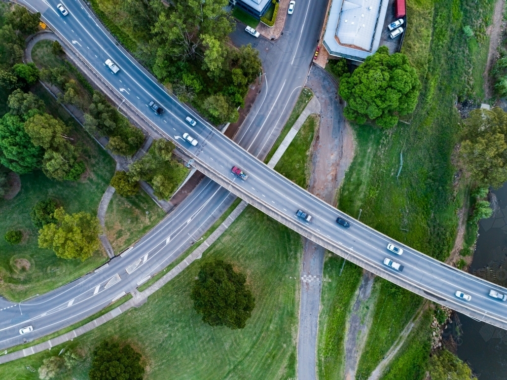 Aerial view of overpass bridge with roads crossing of highway and main street - Australian Stock Image