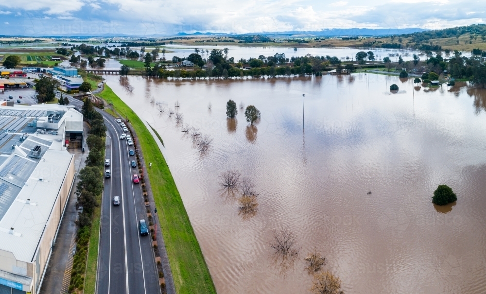 Aerial view of playing field underwater during flood in SIngleton - Australian Stock Image