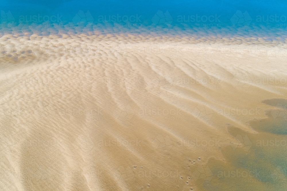 Aerial view of ripples of a tidal sandbar in Seventeen Seventy, Queensland. - Australian Stock Image