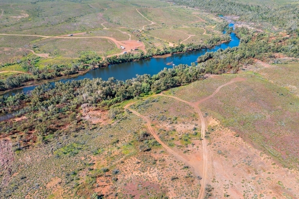 aerial view of river in the pilbara with waterhole and rest area - Australian Stock Image