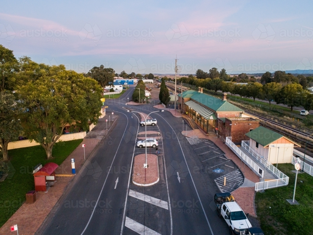 Aerial view of road, bus shelter and train station showing public transport infrastructure - Australian Stock Image