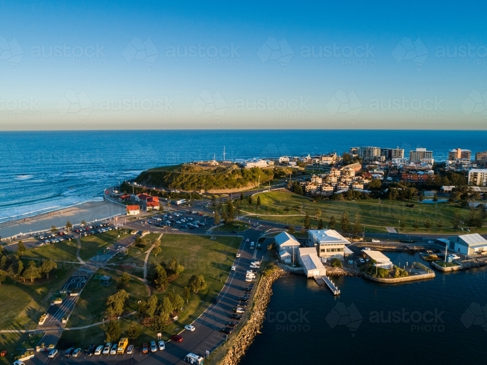 Aerial view of seaside headland with Newcastle city and recreational area - Australian Stock Image