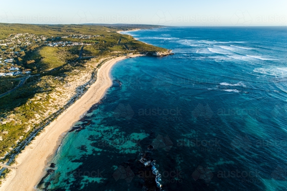 Aerial view of seaside town, beach, headland, and ocean - Australian Stock Image