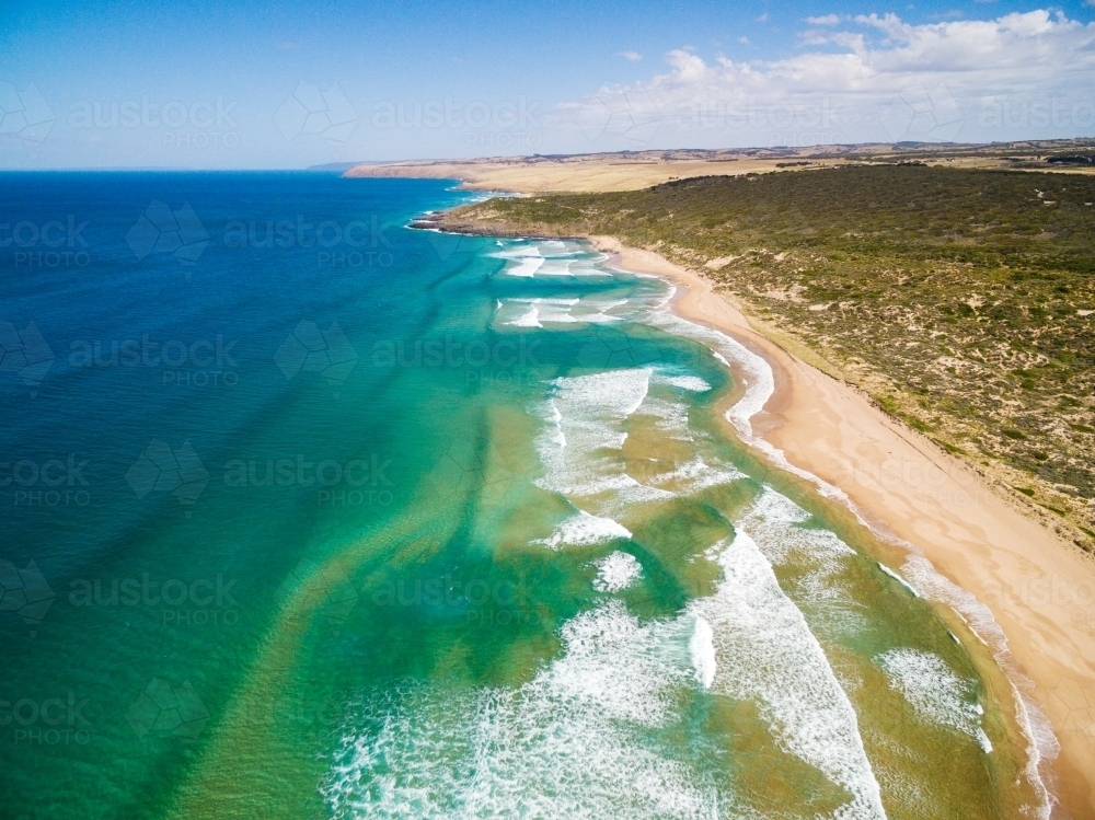 aerial view of shoreline with rips in water - Australian Stock Image