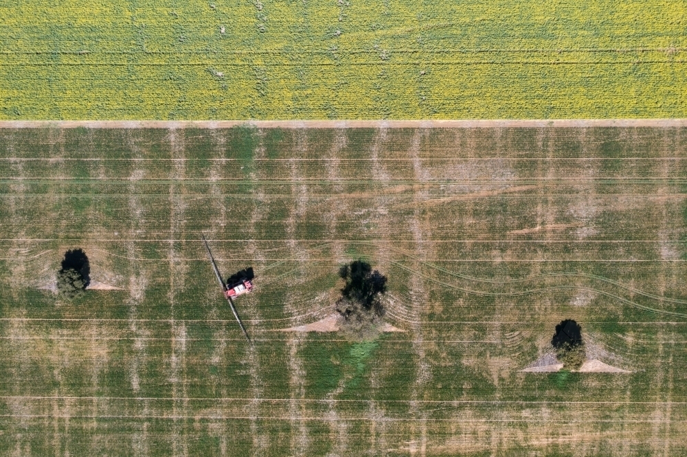 Aerial view of spraying on farm - Australian Stock Image