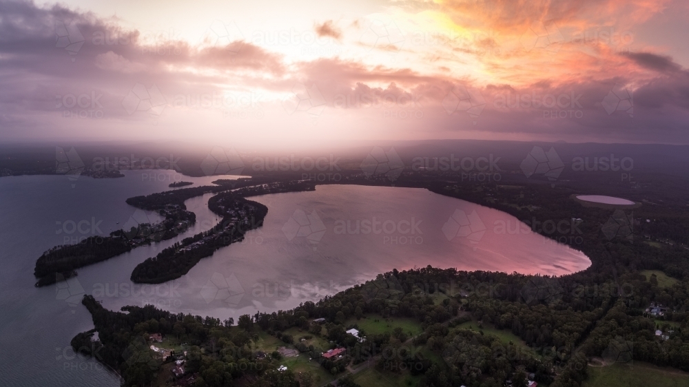 Aerial view of sunset over Dora Creek and Eraring on Lake Macquarie on the NSW Central Coast - Australian Stock Image