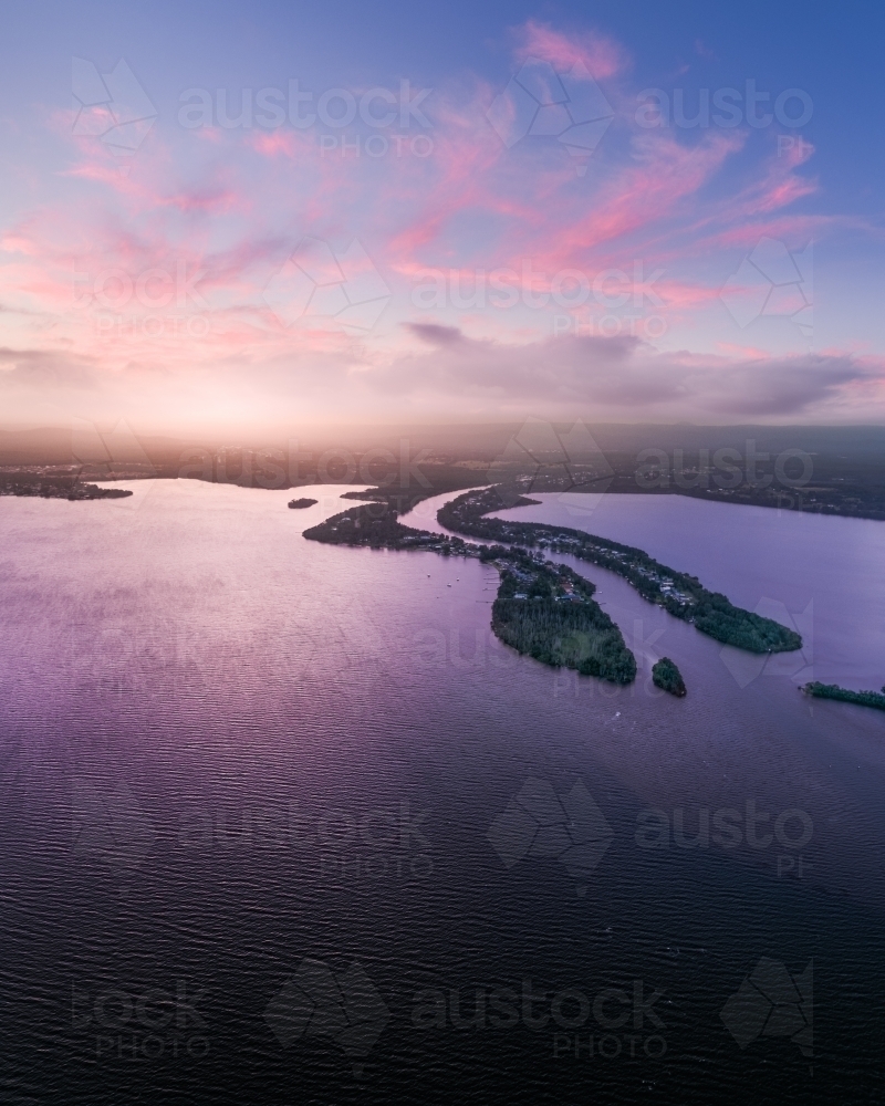 Aerial view of sunset over Dora Creek and Eraring on Lake Macquarie on the NSW Central Coast - Australian Stock Image