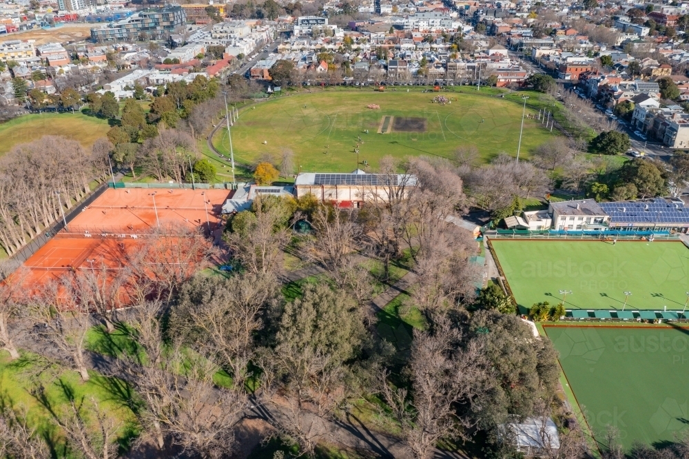 Aerial view of tennis courts and sports ovals in a city park - Australian Stock Image