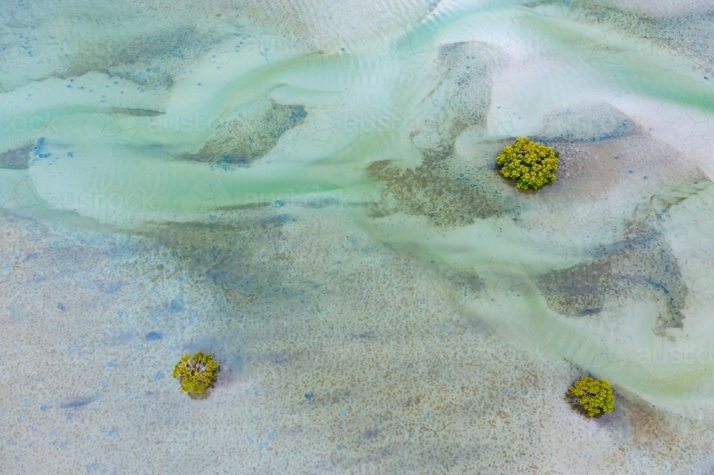 Aerial view of tidal patterns and sand bars in a coastal estuary - Australian Stock Image