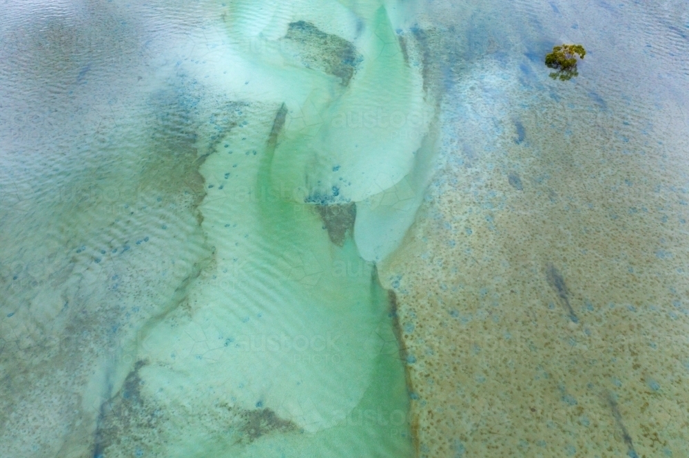 Aerial view of tidal patterns and sand bars in a coastal estuary - Australian Stock Image