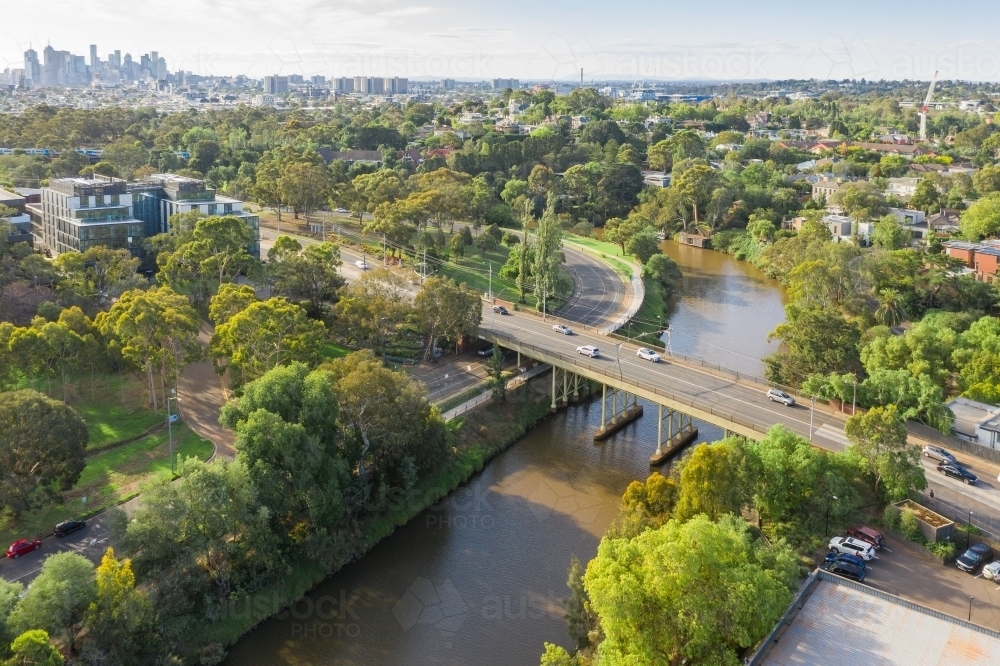 Aerial view of traffic on a bridge over an inner city river - Australian Stock Image