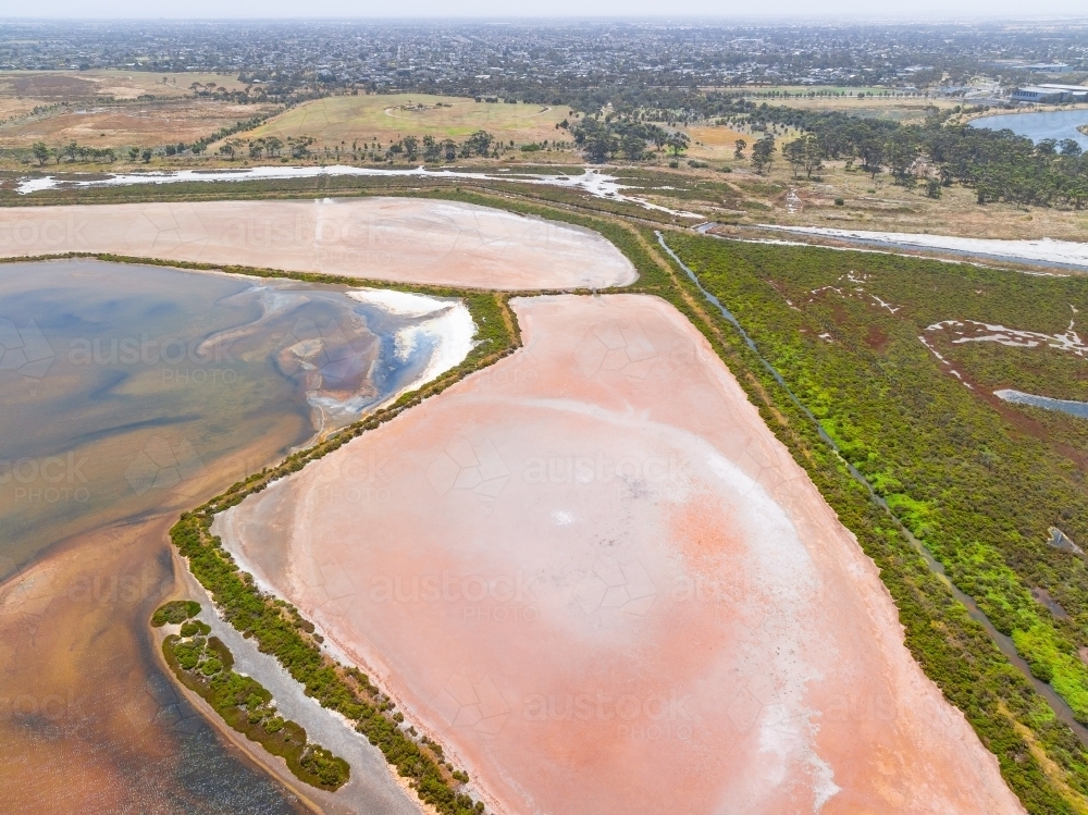 Aerial view of wetlands with colourful vegetation and dry salt lakes - Australian Stock Image