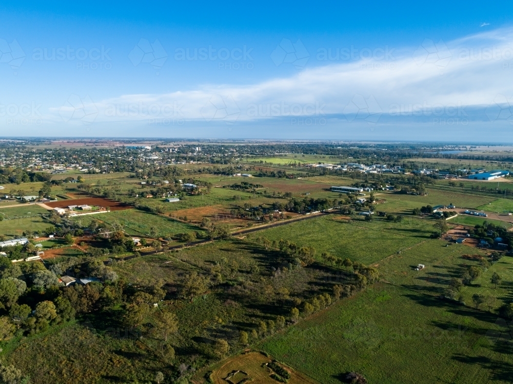 Aerial view over green farm paddocks and properties in good season after rain - Australian Stock Image