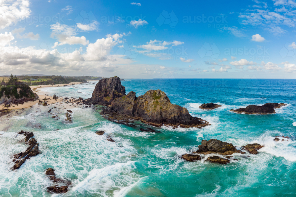 An aerial shot in late summer afternoon of Glasshouse Rocks Beach near Narooma, NSW, Australia - Australian Stock Image