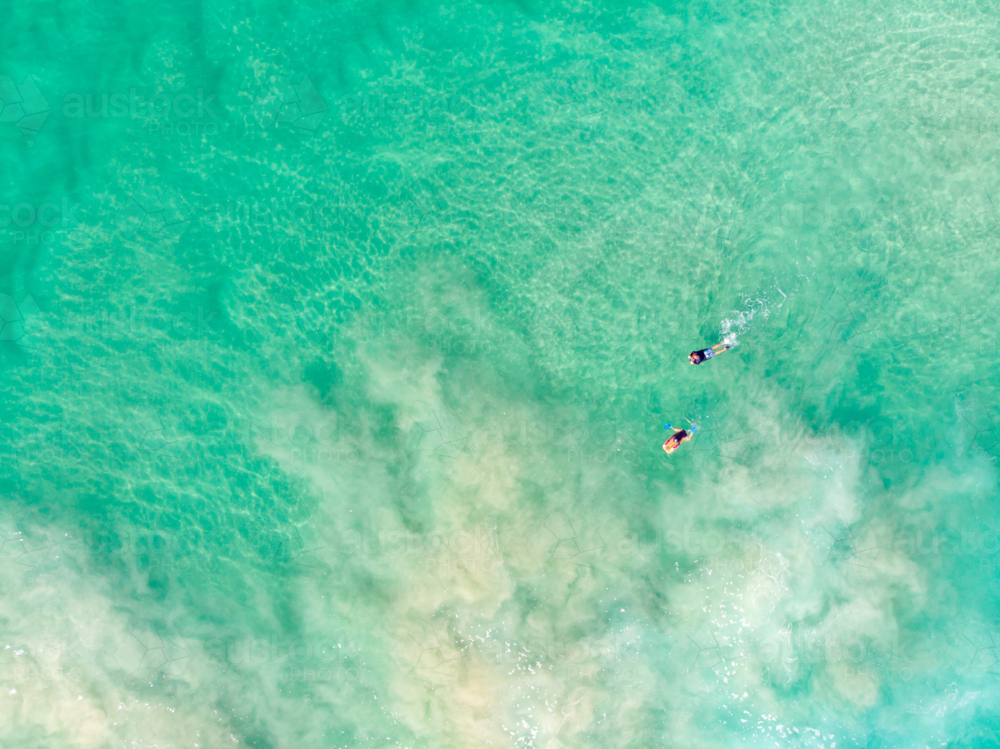 An aerial view of surfers at Cabarita Beach. - Australian Stock Image