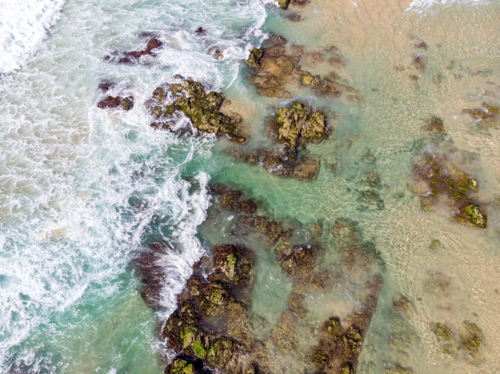An aerial view of the coastline sea and sand on Cabarita Beach at Hastings Point in New South Wales, - Australian Stock Image