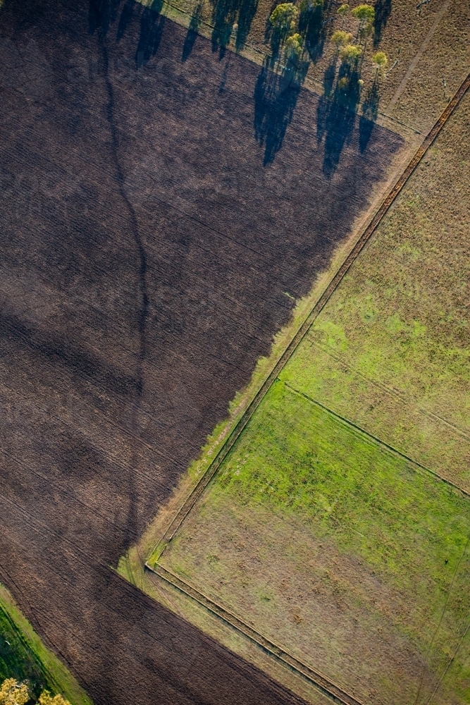 An aerial view of the land and paddocks early in the morning in Ipswich. Queensland, Australia. - Australian Stock Image