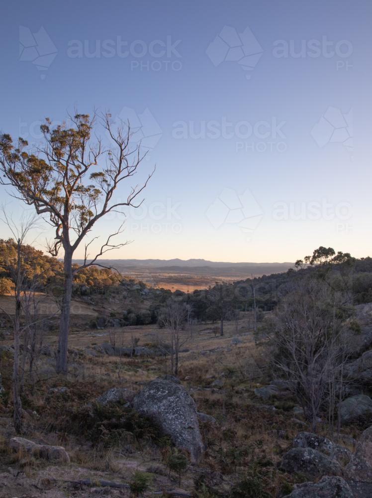 An early morning overlooking a shadowed valley - Australian Stock Image