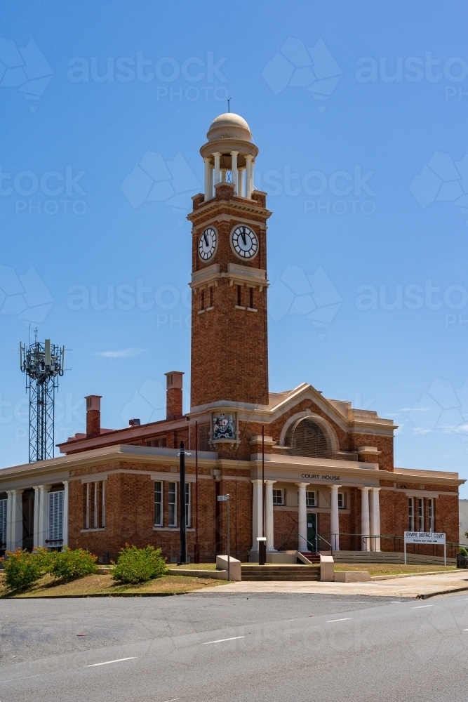 An historic courthouse with a tall clock tower and cupola - Australian Stock Image