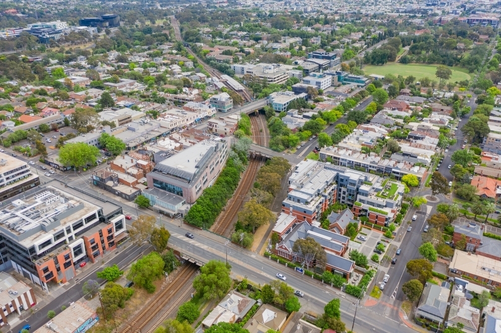 An inner city rail corridor going under bridges and through a city suburb - Australian Stock Image