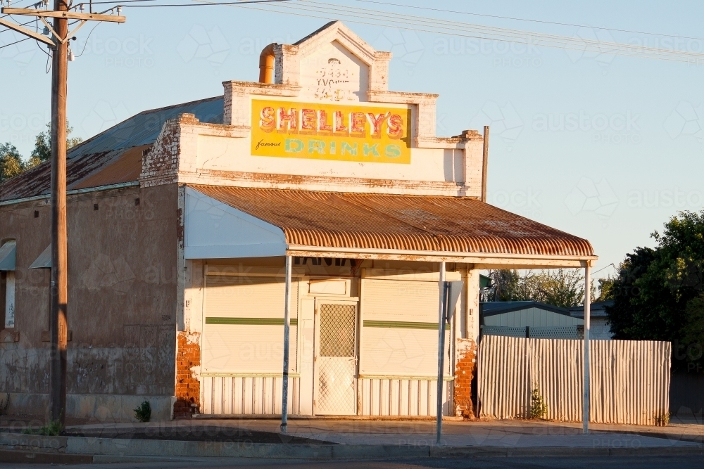 An old corner store sits in morning sunshine - Australian Stock Image