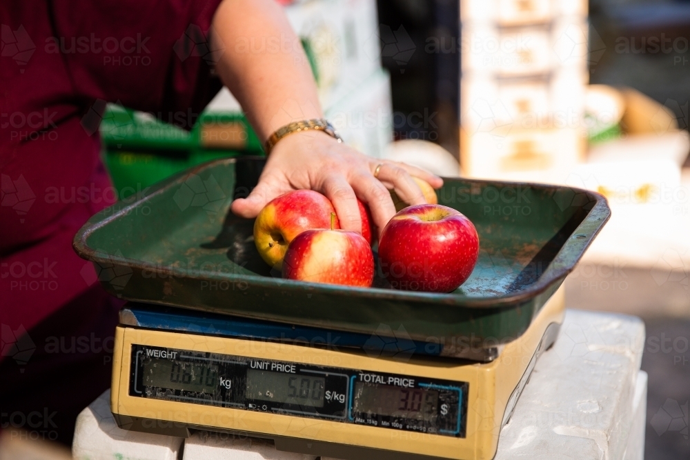 Kitchen scale weighting apples, Stock image