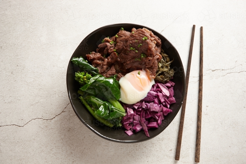 Asian beef soup ingredients in bowl - Australian Stock Image