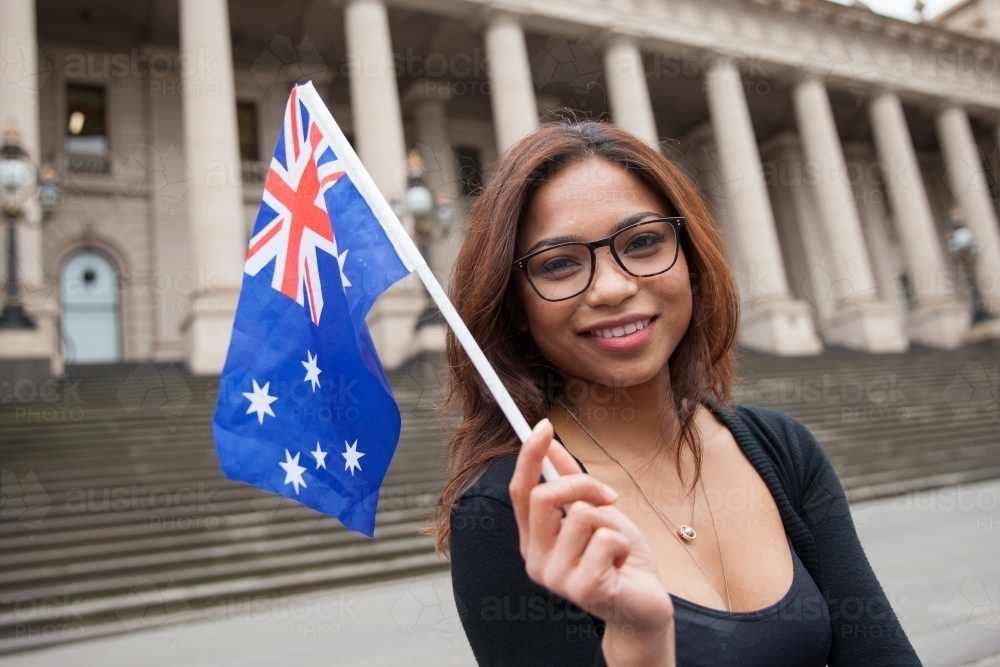 Asian Woman Waving An Australian Flag - Australian Stock Image