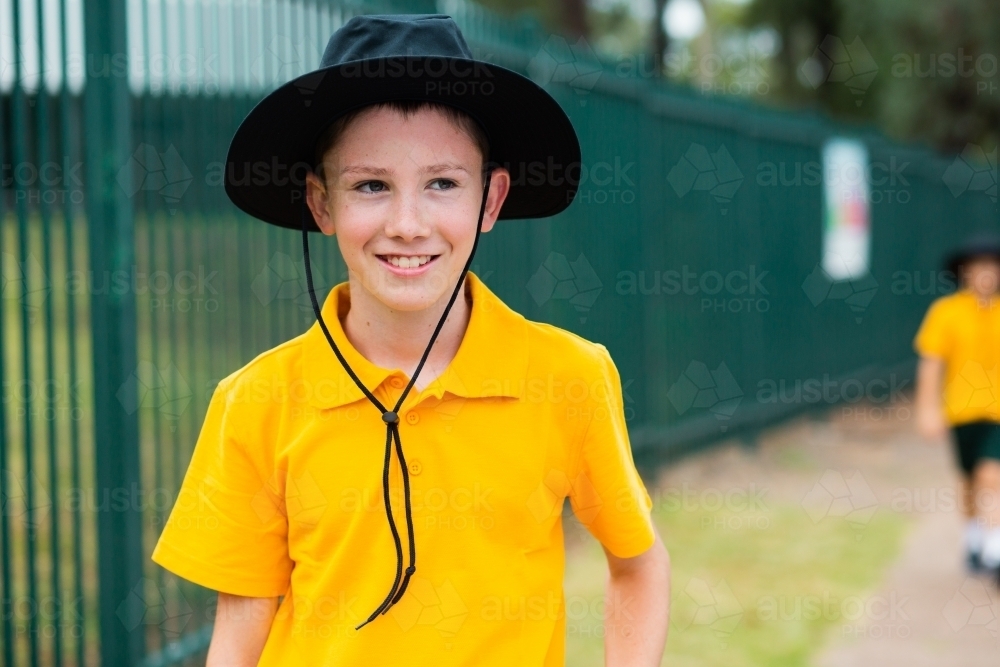 Aussie school boy with a hat outside - Australian Stock Image