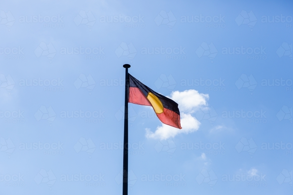 Australian Aboriginal flag flying on a flagpost - Australian Stock Image