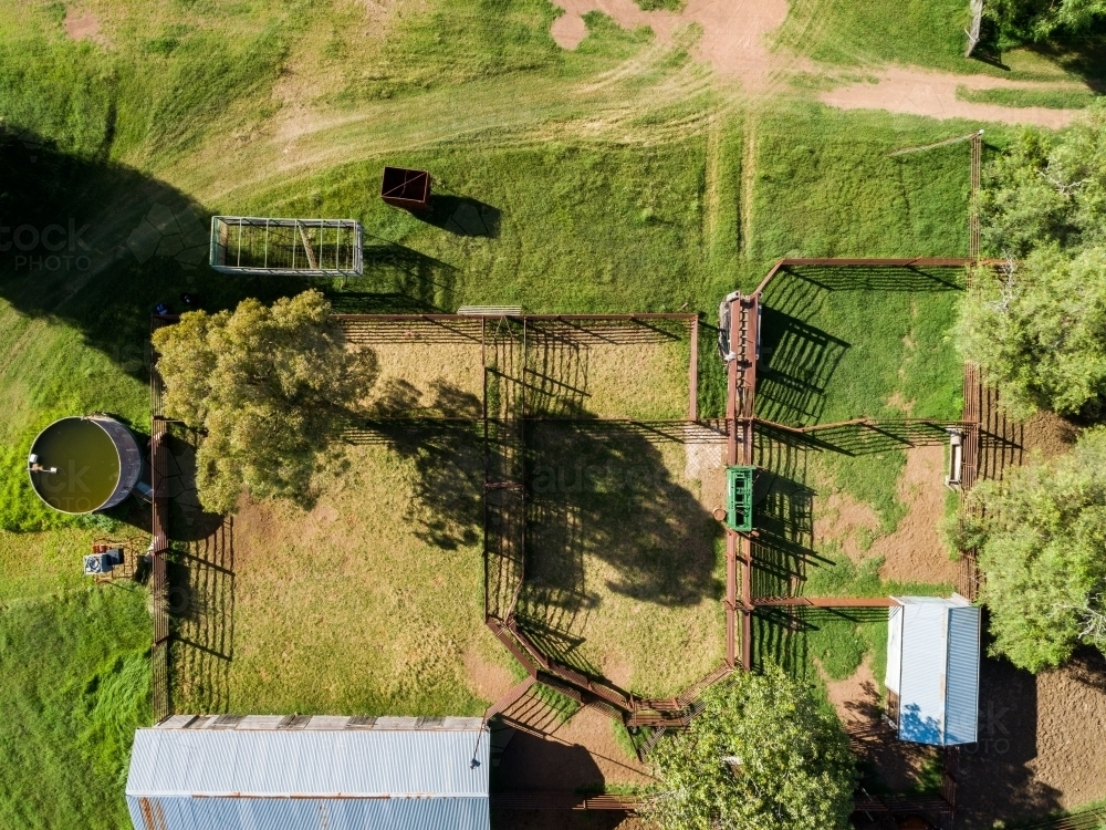 Australian cattle yards seen in overhead top down aerial view on farm with sheds - Australian Stock Image