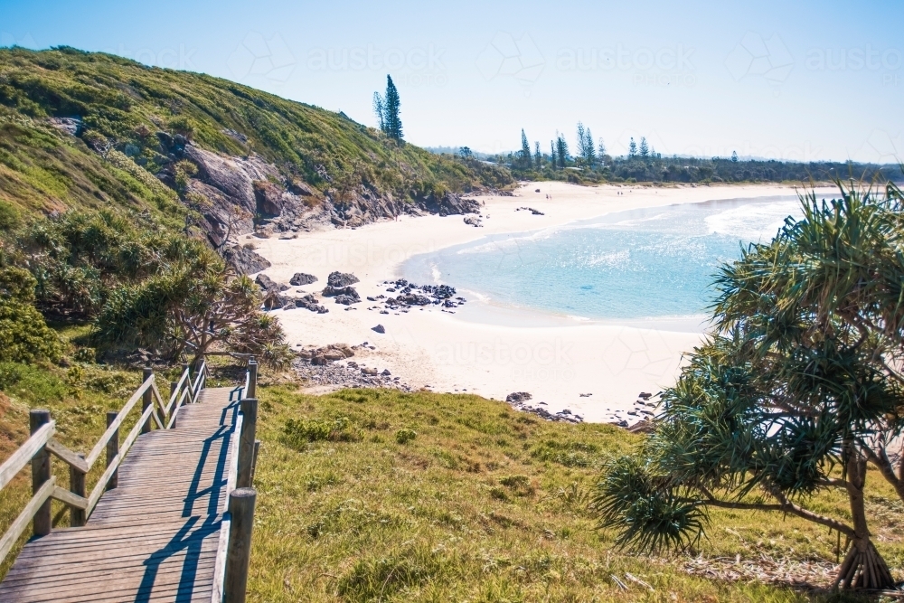 Australian coastline with wooden pathway leading down to beach. - Australian Stock Image