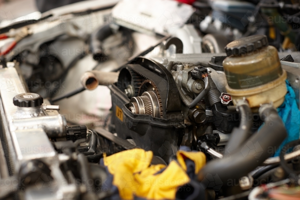 Automotive work on engine of vehicle - Australian Stock Image