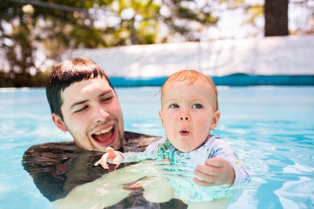 Image Of Baby With Excited Expression In Swimming Pool Water With ...