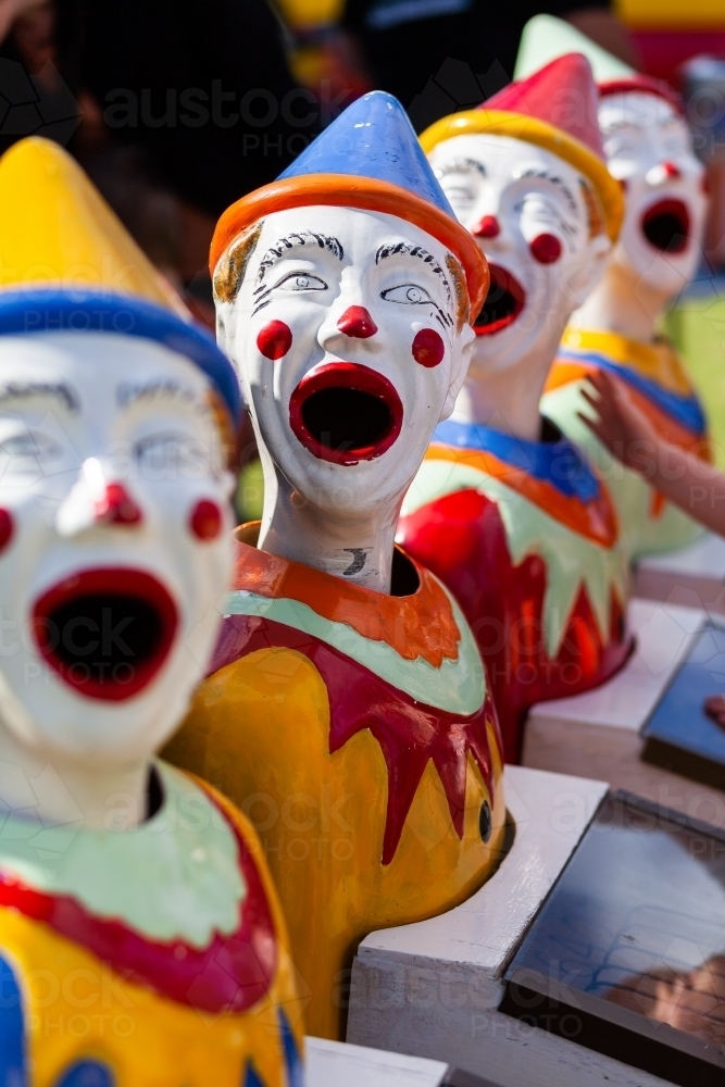 Ball game with clown heads at fun local event for kids - Australian Stock Image